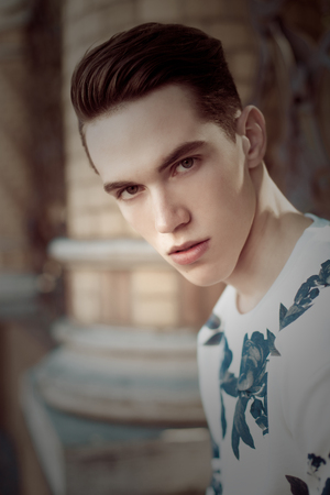 Young stylish man portrait with a vintage retroの写真素材