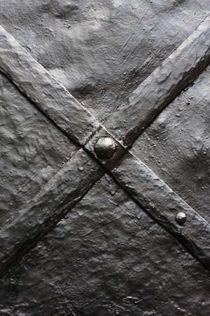 \rWeathered and rusty decoration element of vintage metal doors\r\rの写真素材