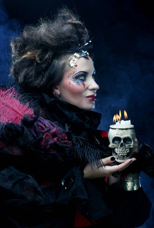 Picture a beautiful fantasy woman with skull. Halloween theme. Party theme.の写真素材