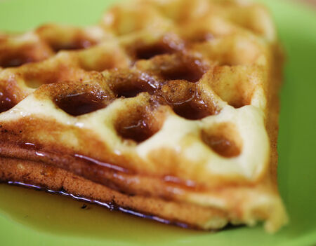 delicious Belgian waffles on green placeの写真素材