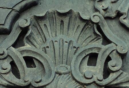 \rWeathered and rusty decoration element of vintage metal doorsの写真素材