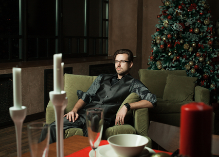 Fashion Man in luxury modern interior, Cristmass time.の写真素材