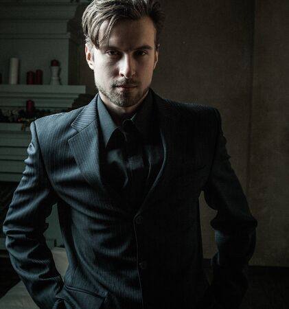 Fashion young man in luxury modern interiorの写真素材