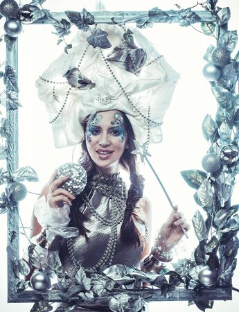 Winter beauty woman. Holiday makeup. Winter Queen with snow and ice hairstyleの写真素材