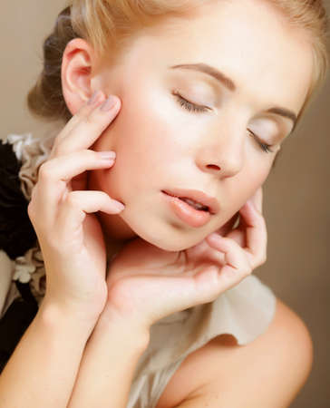 Portrait of beautiful woman isolated on beigeの写真素材