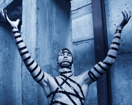 Man with creative face-art. Cyber zombi style. Shot in destroyed building.の写真素材