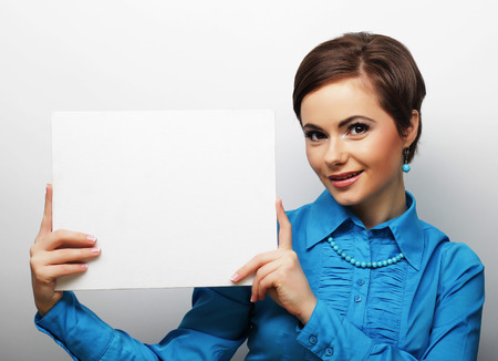 young casual woman happy holding blank sign, happy timeの写真素材