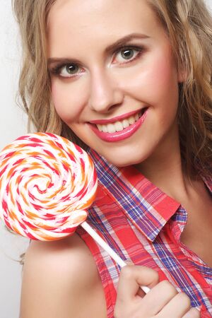Nice young girl with lolipopの写真素材
