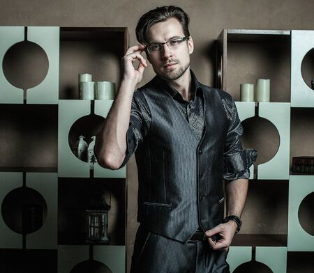 Fashion young man in luxury modern interiorの写真素材