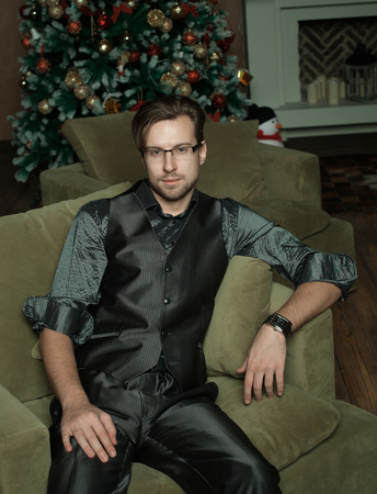 Fashion Man in luxury modern interior, Cristmass time.の写真素材