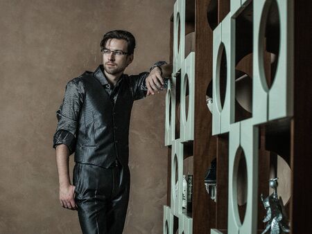 Fashion young man in luxury modern interiorの写真素材