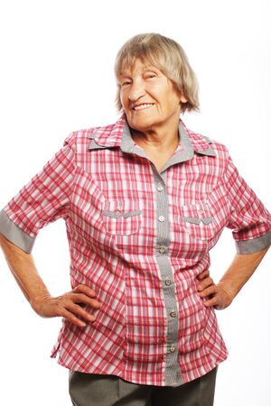 Portrait of a happy senior woman against whiteの写真素材