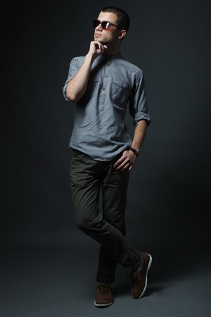 Handsome man with sunglasses. Studio shot.の写真素材