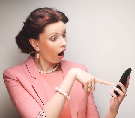 young funny businesswoman with mobileの写真素材