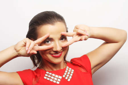 close up portrait young happy woman in red dress