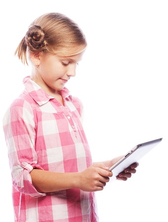 Pretty little girl with a Tablet PC. Isolated on white.の写真素材