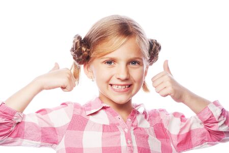 Portrait of a beautiful and confident girl showing thumbs up isolated one whiteの写真素材