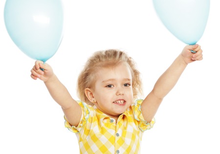 Full isolated studio picture from a little girl with blue balloonsの写真素材