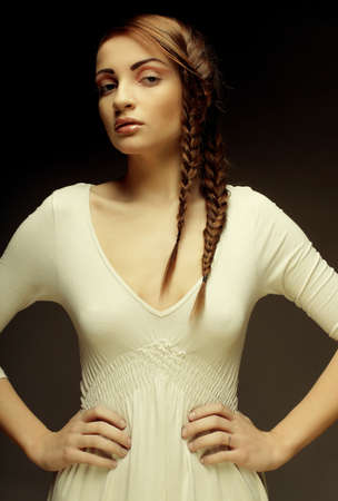 Beautiful fashion model with a creative hairstyling. Studio shot.の写真素材