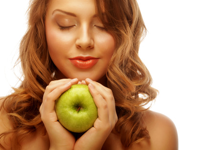 Woman holding green apple.の写真素材