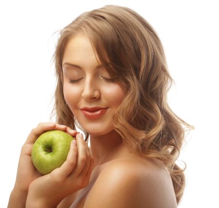 Woman holding green apple.の写真素材