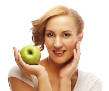 Woman holding green apple.の写真素材