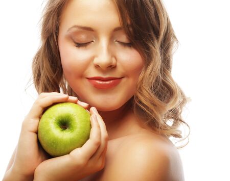 Woman holding green apple.の写真素材