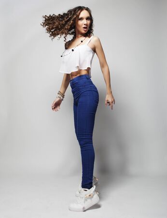 Young fashion model with curly hairの写真素材