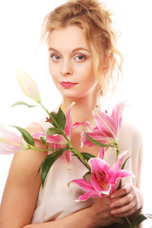 Young woman with pink lilyの写真素材