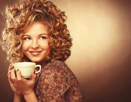 Beautiful woman drinking coffeeの写真素材