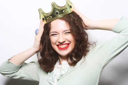 party concept: young lovely expression woman in crownの写真素材