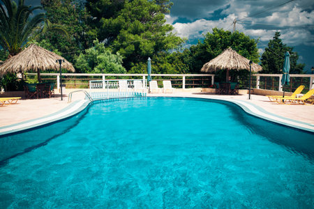 Swimming pool with stair at hotel, Greeceのeditorial素材
