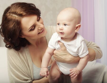Portrait of happy mother and baby