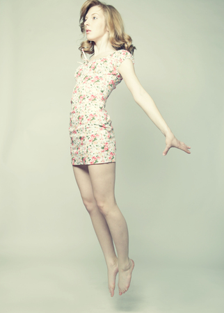 Young beautiful happy woman jumpingの写真素材