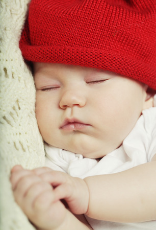 The sweet dream of baby in red hatの写真素材