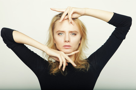 blond fashion model posing in studioの写真素材