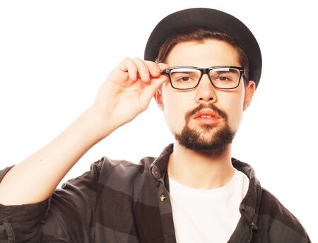 Emotional, happiness and people concept:. Young man  wearing black hat.Studio shot over white .の写真素材
