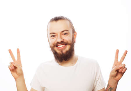 Emotional and people concept: young bearded man with good idea sign. Hipster style.の写真素材