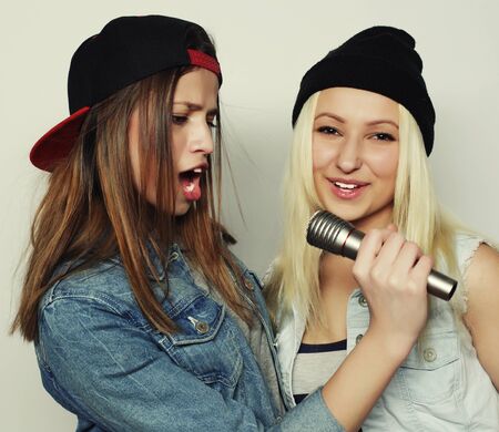 two young hipster girls singingの写真素材