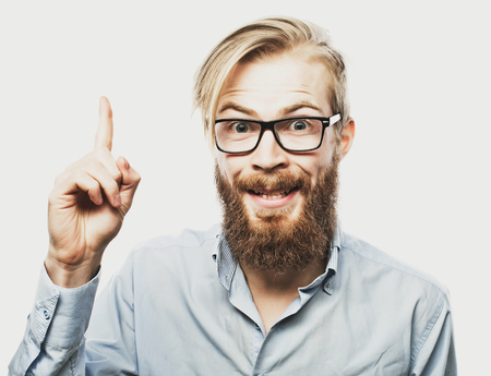 emotional and people concept: young bearded man with good idea sign. Hipster style.の写真素材