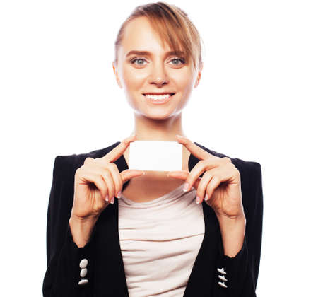 Business, finance and people concept: Smiling business woman handing a blank business card over white background. Positive emotion.の写真素材