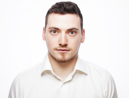 business, success and people concept - young business man wearing white shirt, isolated on white.の写真素材