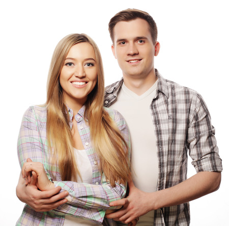 Love, family and people concept:  lovely happy  couple hugging  over white background.の写真素材