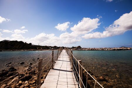travel and vacation concept - wooden bridge, sea, summer, vacation, happy timeの写真素材