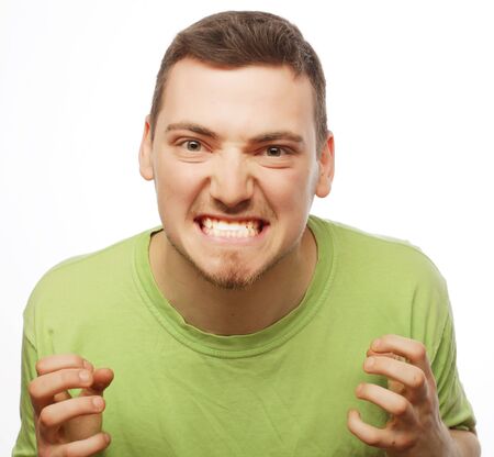 life style  and people concept: happy young man in green t-shirt. Isolated on white.の写真素材