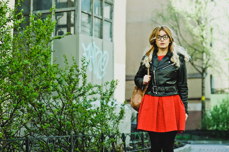 fashion hipster portrait of young beautiful blonde woman posing outdoor in summerの写真素材