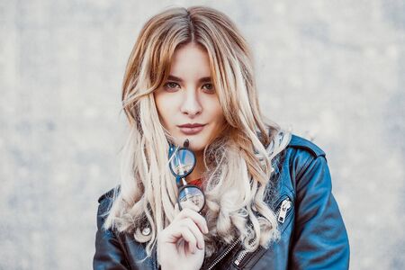 young hipster woman in the city, spring timeの写真素材