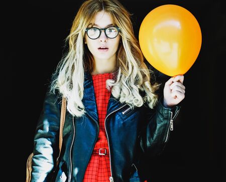 young hipster woman with balloon in the city, spring timeの写真素材