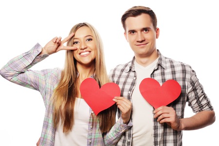 Love, family and people concept: Happy couple in love holding red heartの写真素材
