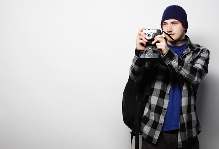 technology, people and life style concept: young  photographer over white backgroundの写真素材